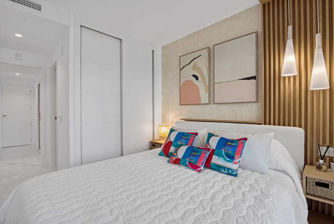 Elegant sea view apartments for sale in Costa Blanca with beach access, modern design, and communal pools.