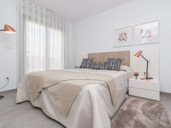 Modern ready apartments for sale in Alicante featuring rooftop terraces, private gardens, communal pool, and close proximity to beaches and golf courses.
