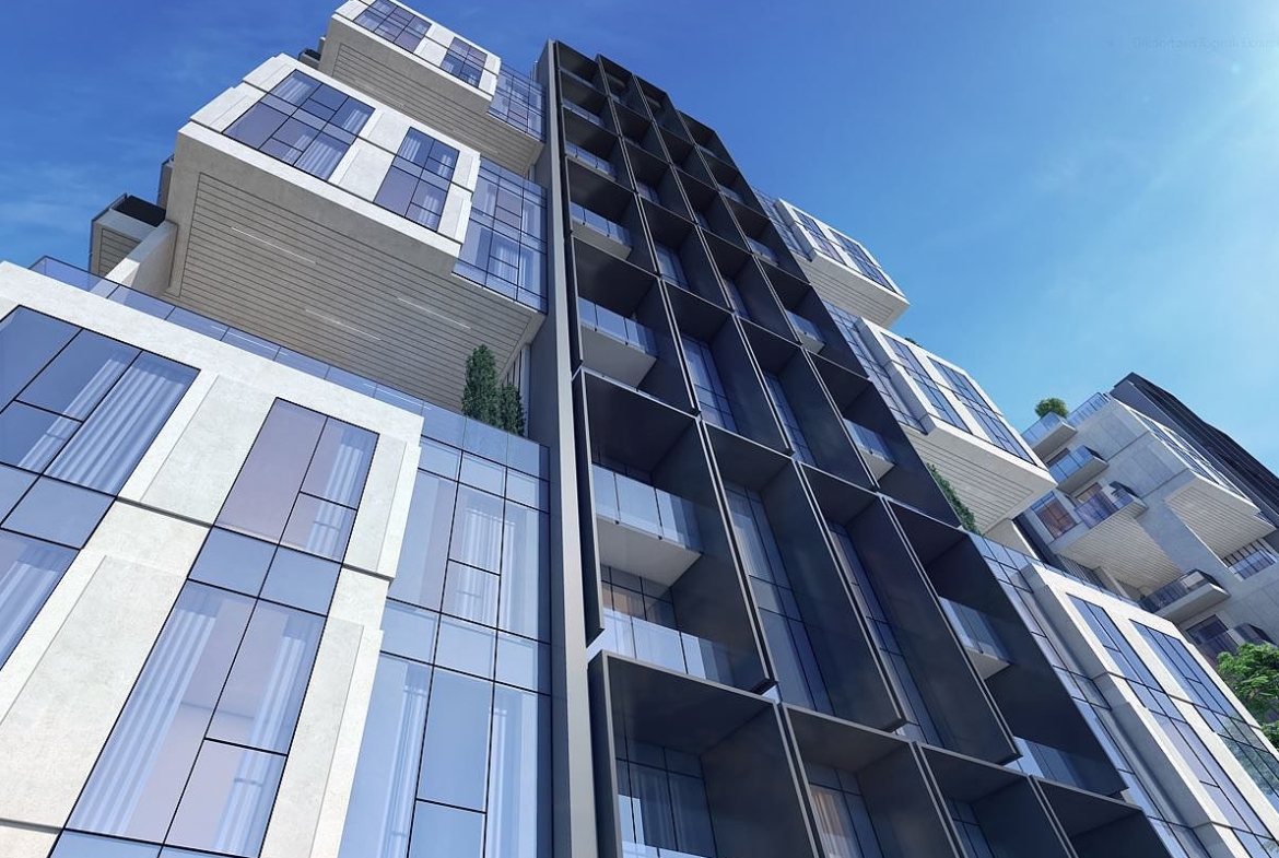 Modern buildings with green landscaping.